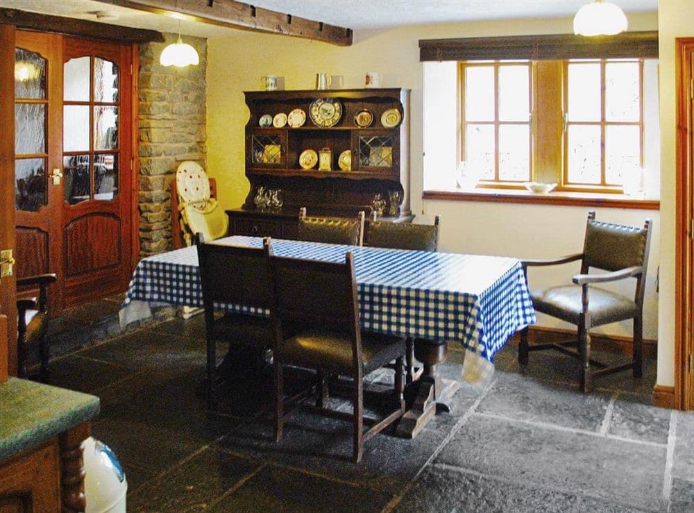 The traditional beamed kitchen/dining area at The Dovery in Sedbergh, Cumbria