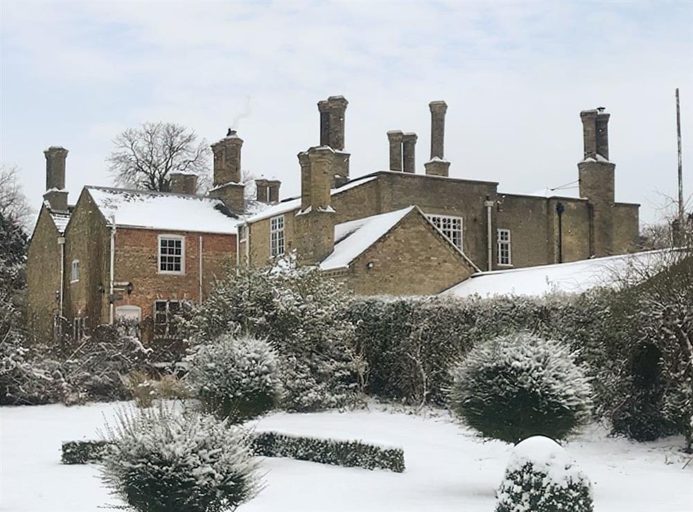Exterior in winter snow at The Dower House in Stow Bardolph, near King’s Lynn, Norfolk