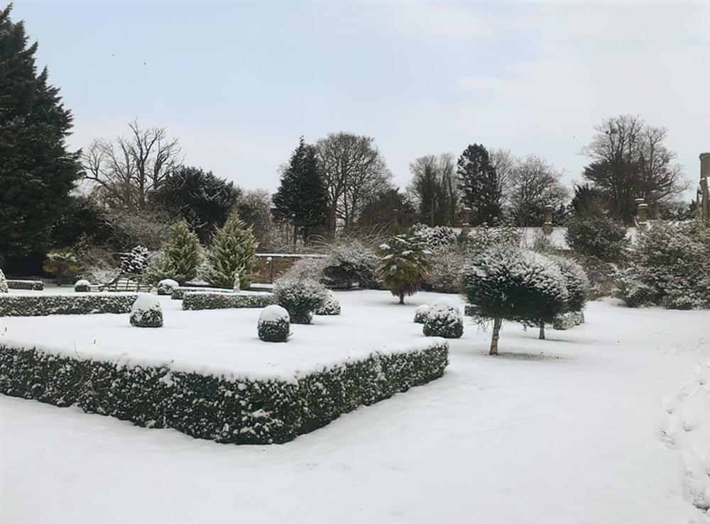 Garden in winter snow at The Dower House in Stow Bardolph, near King’s Lynn, Norfolk