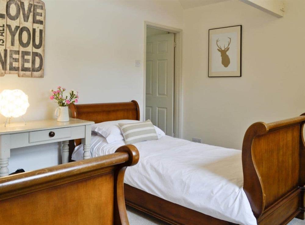 Twin bedroom at The Downs Barn Lodge in Frampton Mansell, near Stroud, Gloucestershire