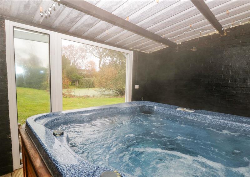 Relax in the hot tub at The Duck House, Thompson near Watton
