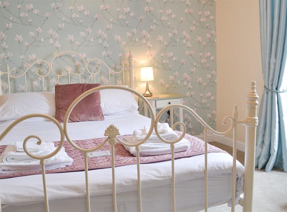 Double bedded room with antique style bed at The Dun Cow in Bishop Middleham near Durham, County Durham, England