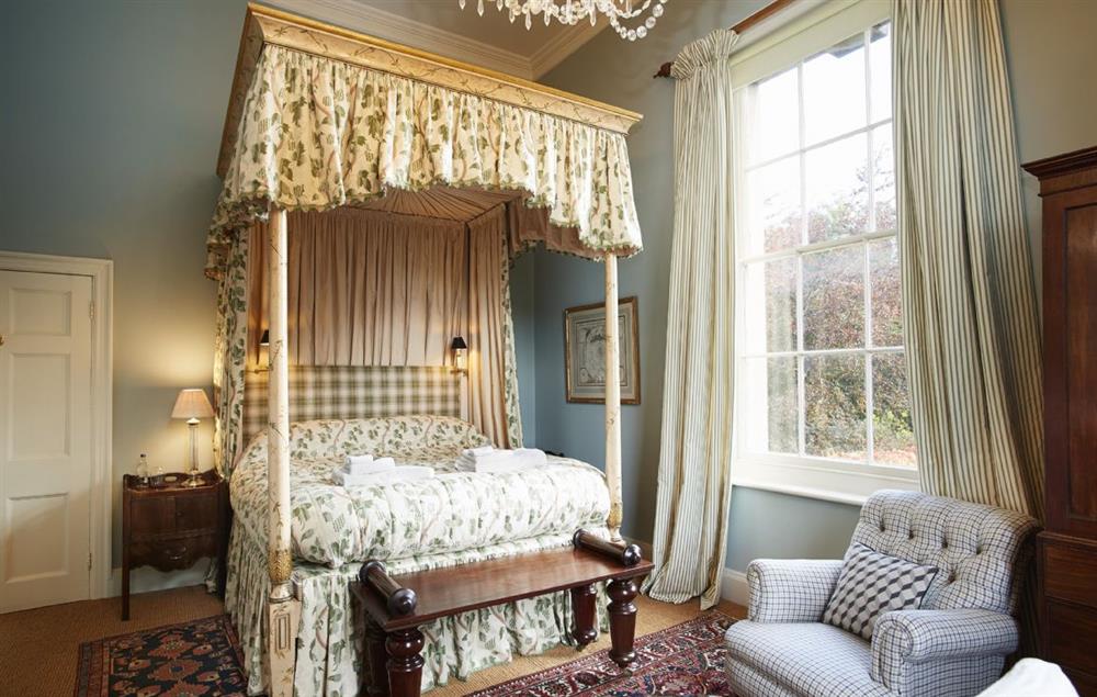 6’ four poster bed with luxury Vi Spring bed and views to the lake on the first floor at The East Wing, Aylsham near Norwich