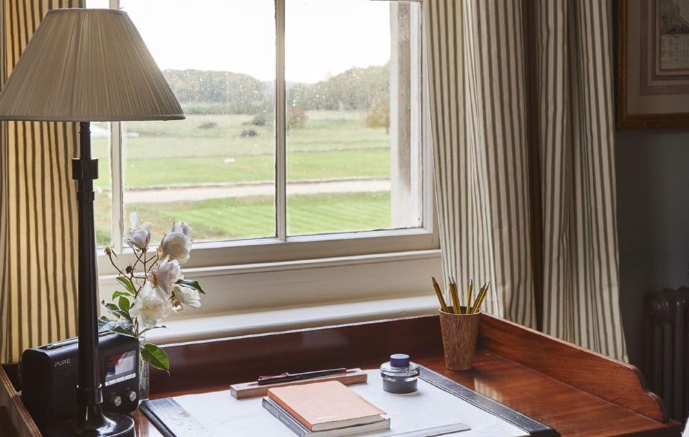 Elegant desk with views looking out to the parkland at The East Wing, Aylsham near Norwich