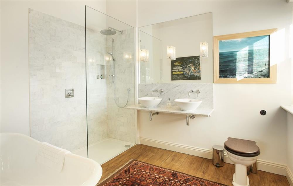 Large bathroom with roll-top bath and separate shower at The East Wing, Aylsham near Norwich