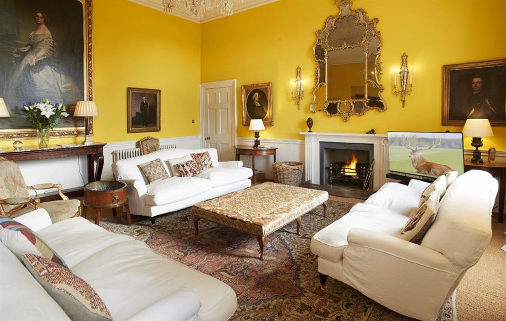 The stunning drawing room with open fire at The East Wing, Aylsham near Norwich