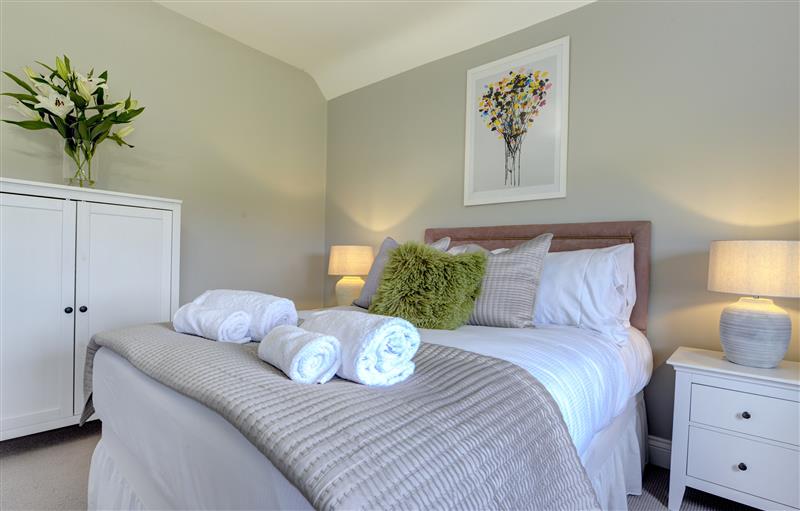 A bedroom in The Farm House (photo 2) at The Farm House, Aldbrough St. John near Barton