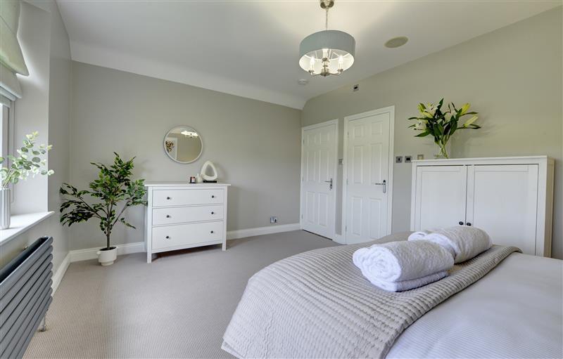 A bedroom in The Farm House (photo 3) at The Farm House, Aldbrough St. John near Barton