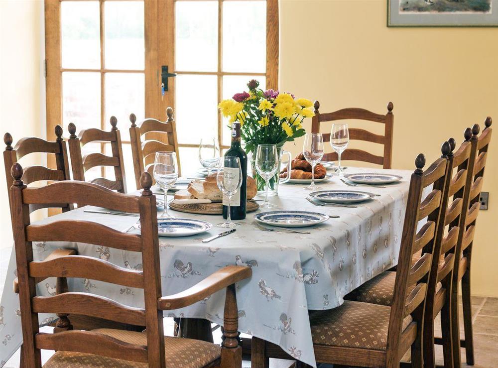 Charming dining area at The Farmhouse at Higher Westwater Farm in Axminster, Devon