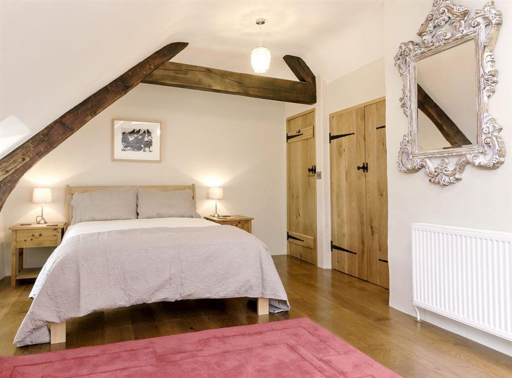 Elegant double bedroom at The Farmhouse at Higher Westwater Farm in Axminster, Devon