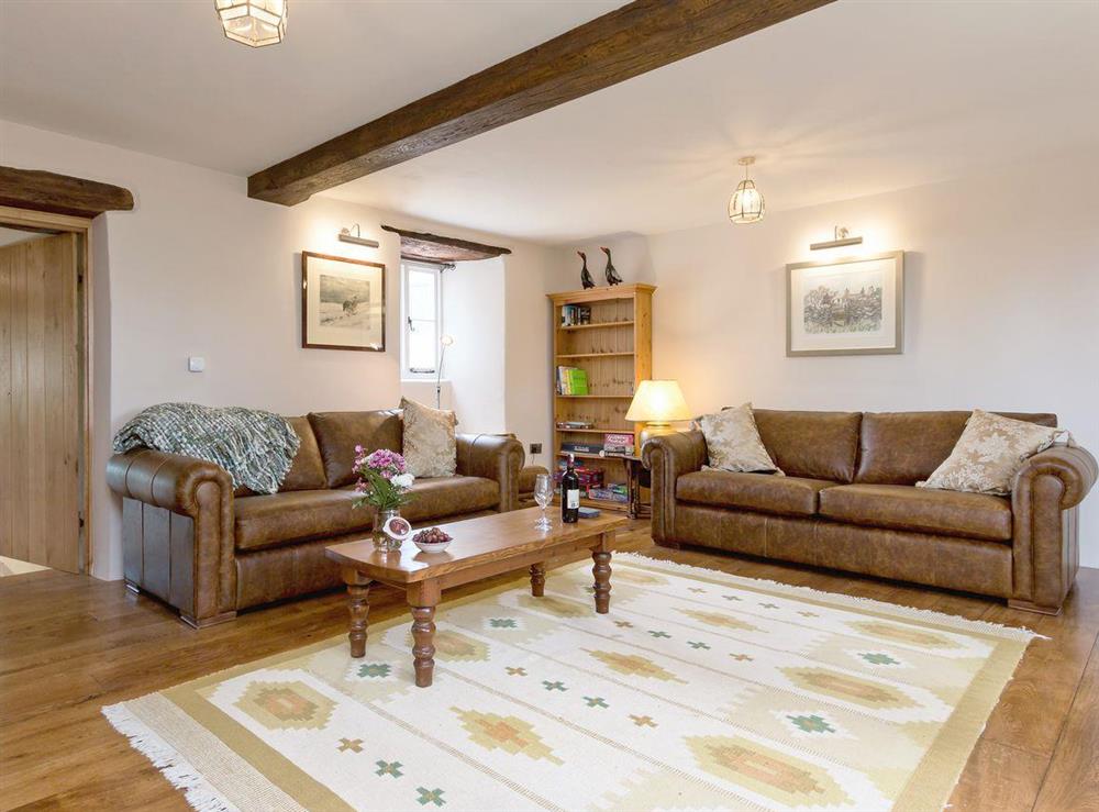 Large, comfortable living room at The Farmhouse at Higher Westwater Farm in Axminster, Devon