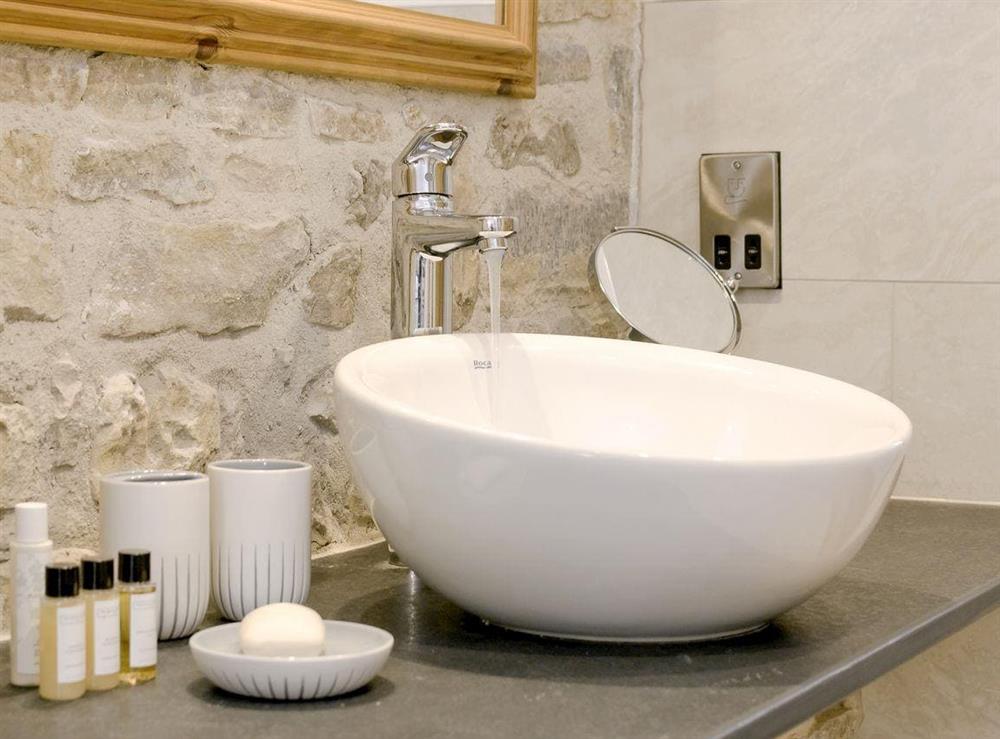 Tranquil bathroom with fabulous fixtures at The Farmhouse at Higher Westwater Farm in Axminster, Devon