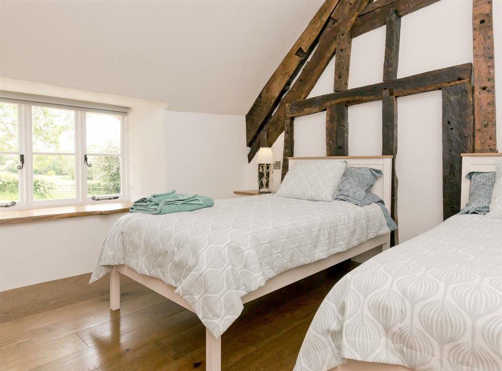 Twin bedroom with pretty views at The Farmhouse at Higher Westwater Farm in Axminster, Devon