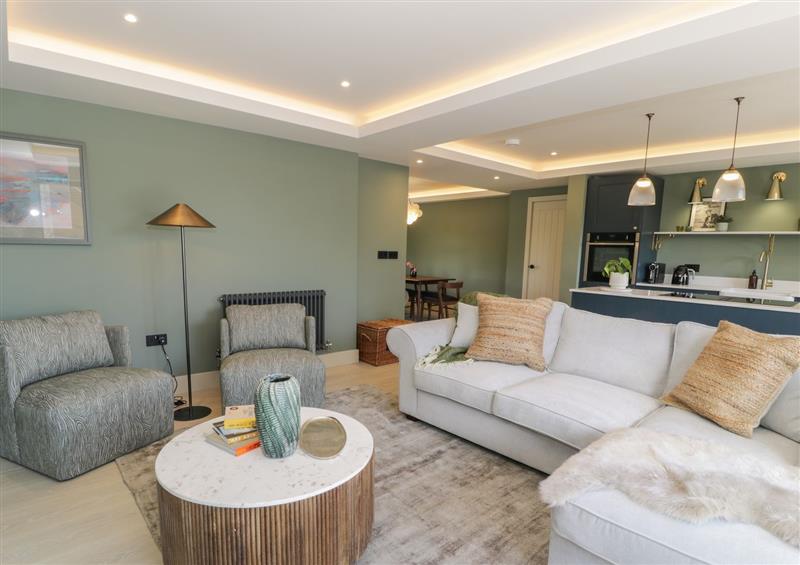 Relax in the living area at The Farmhouse, Llanfechell