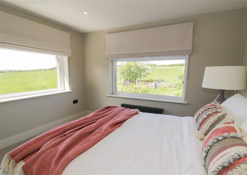 This is a bedroom at The Farmhouse, Llanfechell