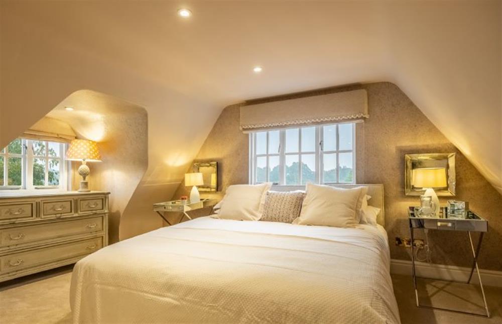 Bedroom five (Martins) with a 6’ super-king size bed at The Farmhouse, Nether Hall Estate, Pakenham