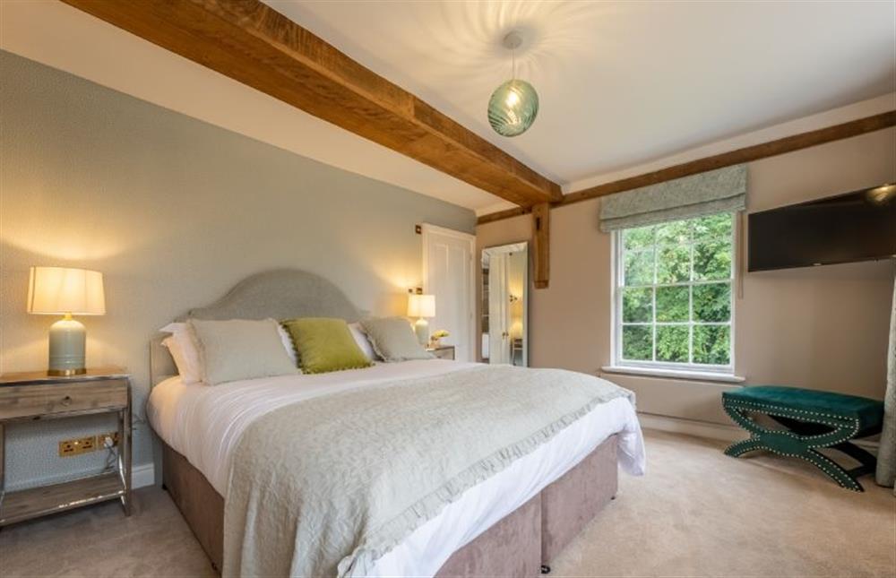 Bedroom three (Swiften) with a 6’ super-king size bed (photo 2) at The Farmhouse, Nether Hall Estate, Pakenham