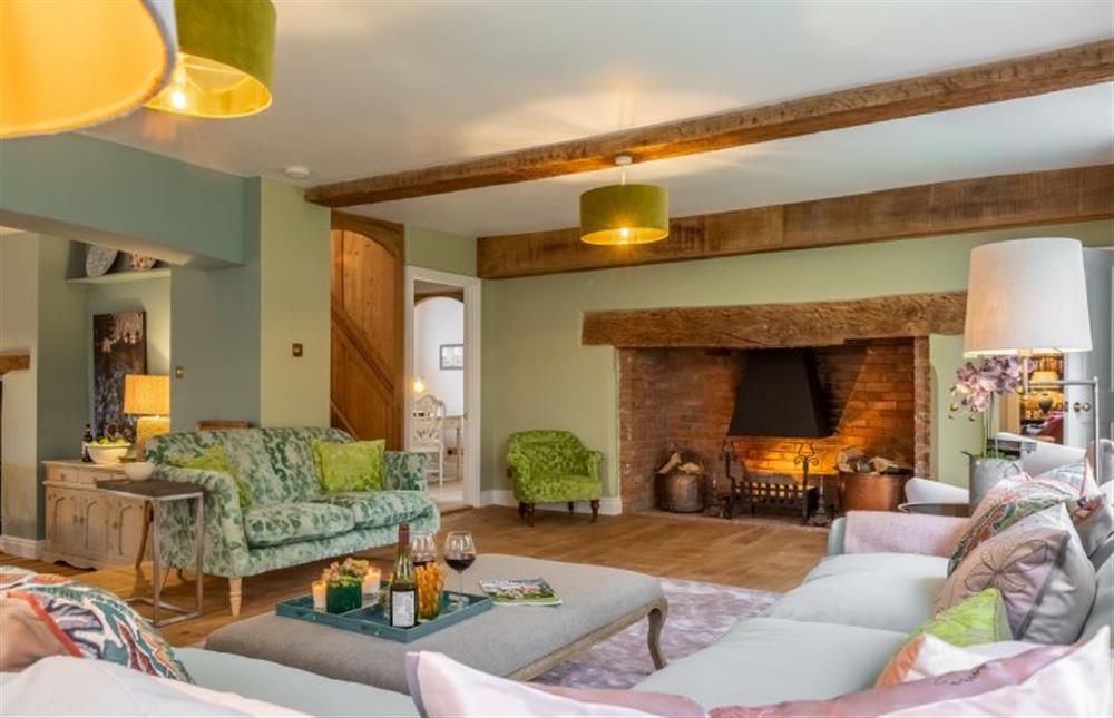 Drawing room with open fire (photo 2) at The Farmhouse, Nether Hall Estate, Pakenham