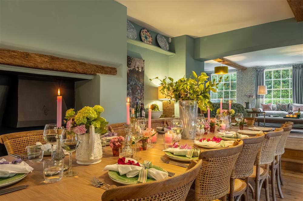 The large dining table with seating for up to fourteen guests at The Farmhouse,  Nether Hall Estate, Pakenham