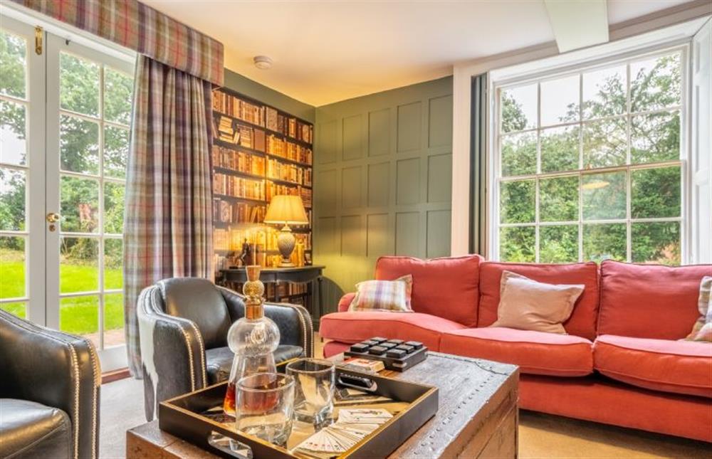 The snug with views of the gardens at The Farmhouse, Nether Hall Estate, Pakenham