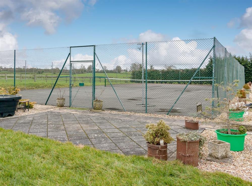 Tennis court at The Farmhouse in West Pennard, near Glastonbury, Somerset