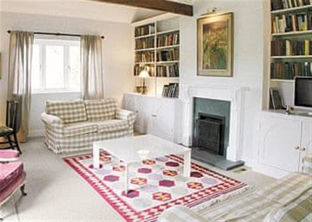 Beautifully designed living room with open fire at The Fishing Lodge in Netton, near Salisbury, Wiltshire