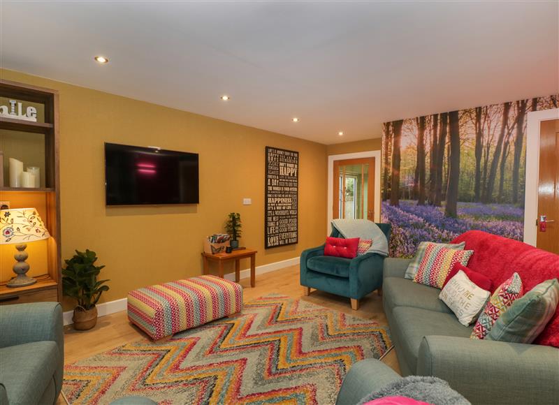 Relax in the living area at The Forest Coach House, Cinderford