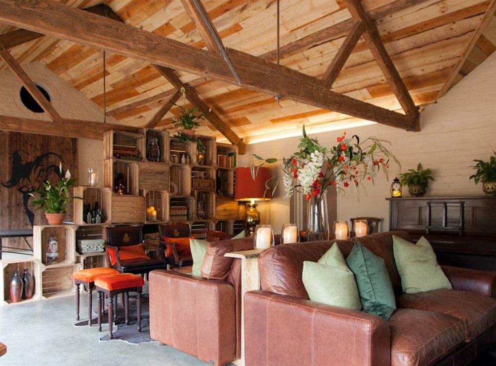Beamed games and sitting rooms at The Forge in Bettiscombe, Nr Lyme Regis, Dorset., Great Britain
