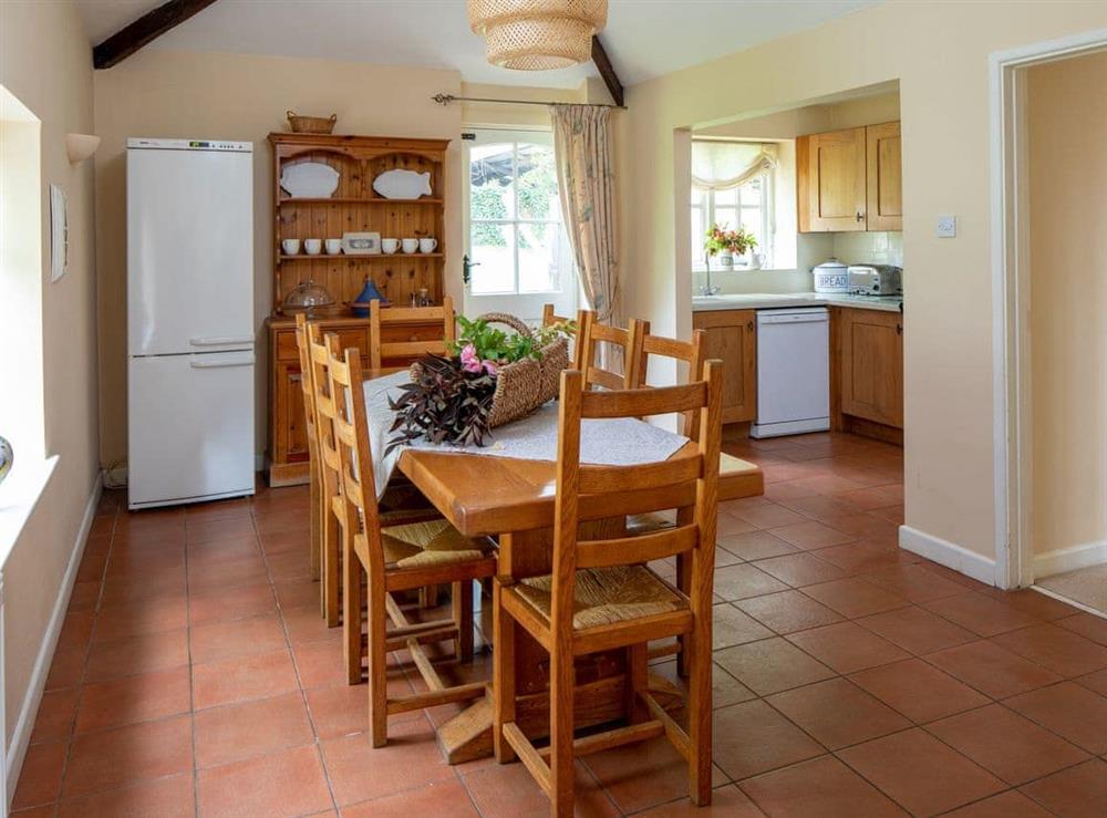 Tile-floored kitchen diner at The Forge in Bettiscombe, Nr Lyme Regis, Dorset., Great Britain