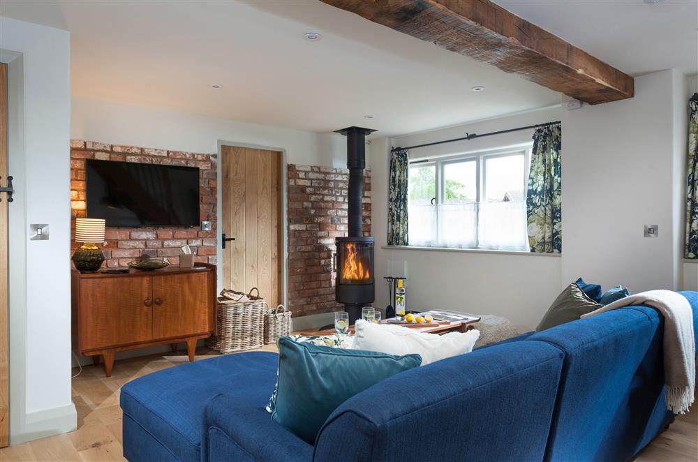 Relax in front of the wood burning stove on cooler evenings  at The Forge, Bridgnorth