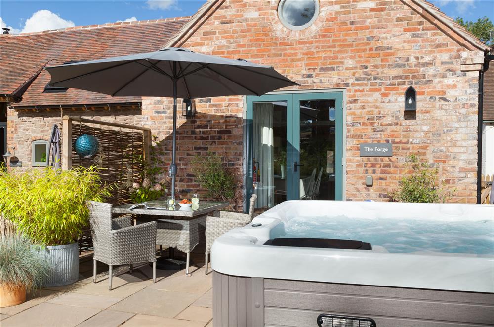 The spacious terrace boasts a hot-tub, perfect for whiling away the evening  at The Forge, Bridgnorth