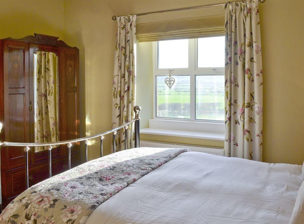 Intimate master bedroom with countryside views at The Gable in Alnwick, Northumberland