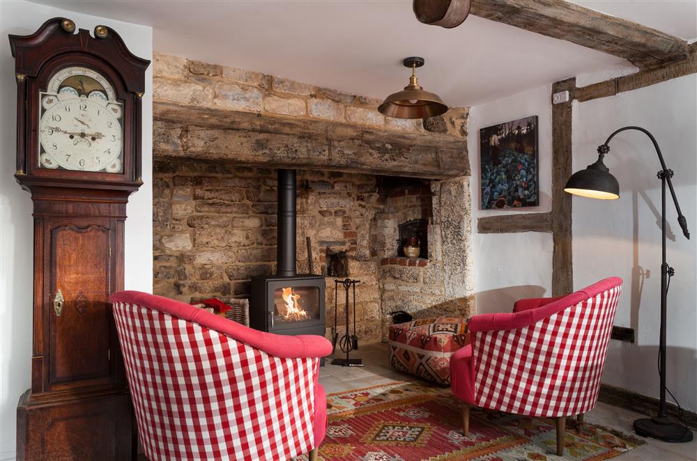 Enjoy the relaxed seating in the dining area in front of the wood burning stove at The Gables, Honeybourne