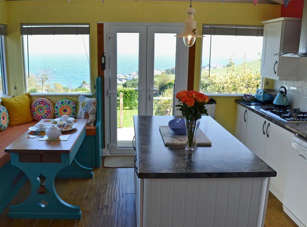 Beamed kitchen/dining room with sea views at The Gallery in Port Mellon, near Mevagissey, Cornwall