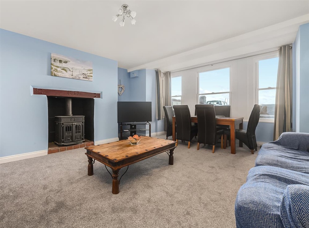 Living room/dining room at The Garden Apartment in Peel, Isle Of Man