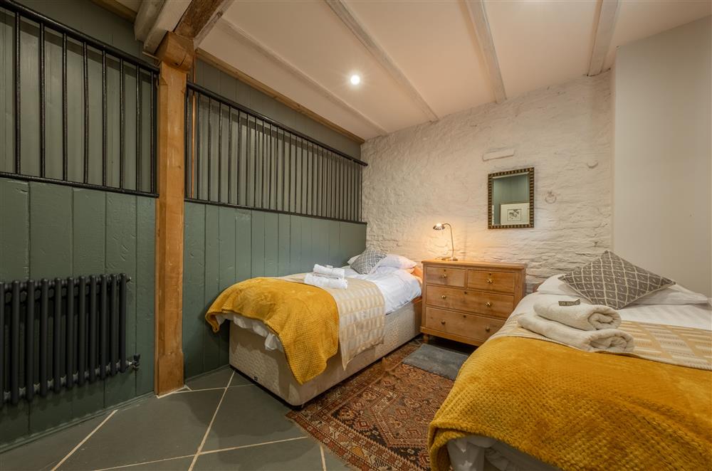 Bedroom four with 3’ twin single beds, in the former stables at The Garden Barn, Peterchurch