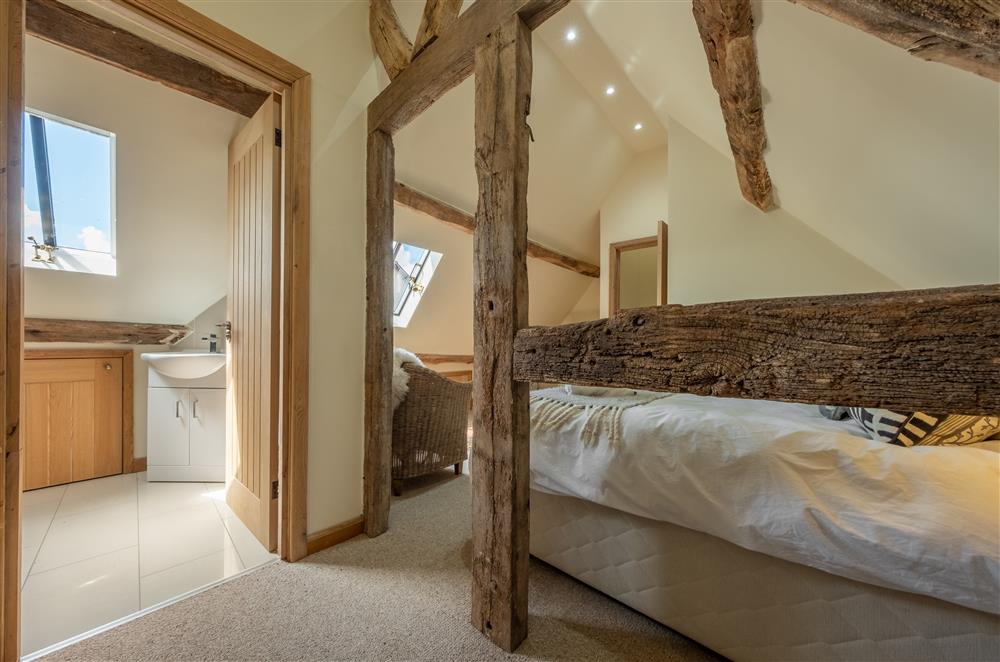 Bedroom one, with exposed timbers and en-suite shower room (photo 3) at The Garden Barn, Peterchurch