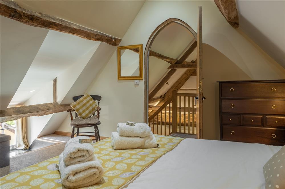 Bedroom two with exposed timbers and 4’6 double bed (photo 2) at The Garden Barn, Peterchurch