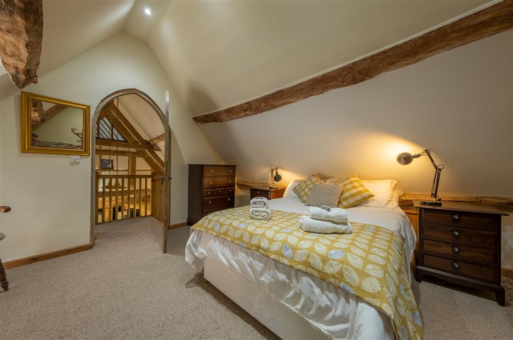 Bedroom two, with exposed timbers and 4’6 double bed (photo 3) at The Garden Barn, Peterchurch