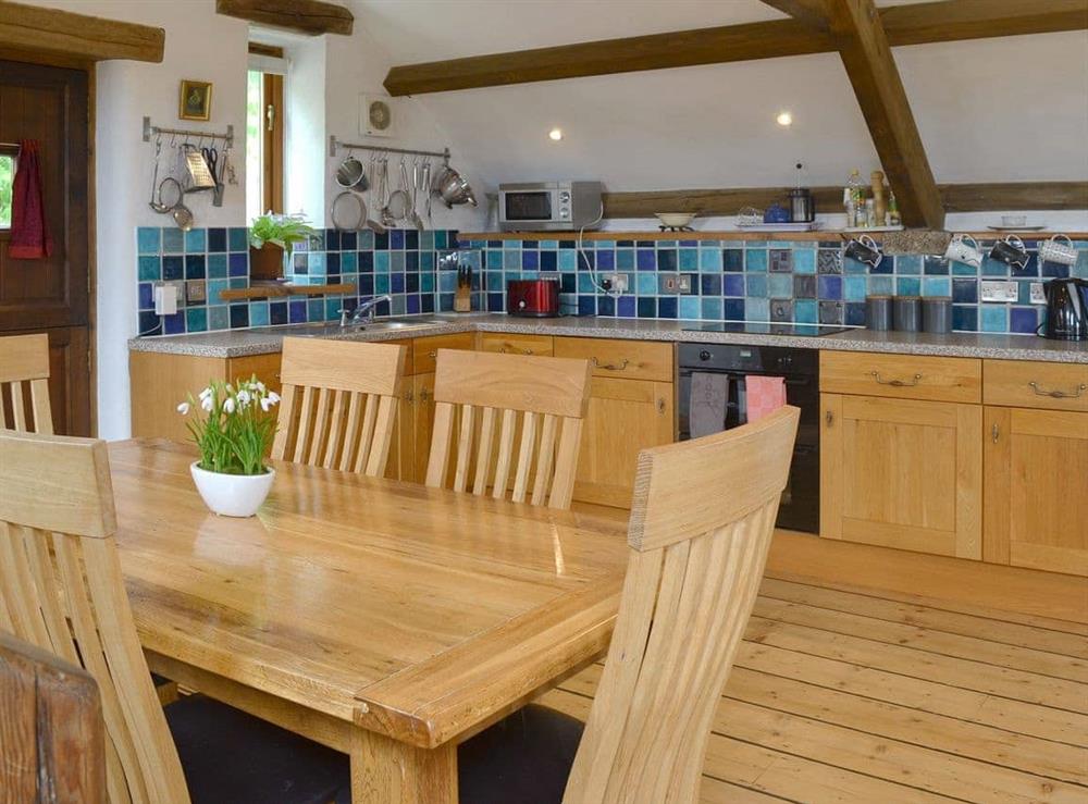 Well equipped kitchen/ dining area at The Garden Barn in Ugborough, Ivybridge, Devon., Great Britain