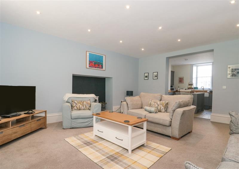 Relax in the living area at The Garden Flat, Charmouth