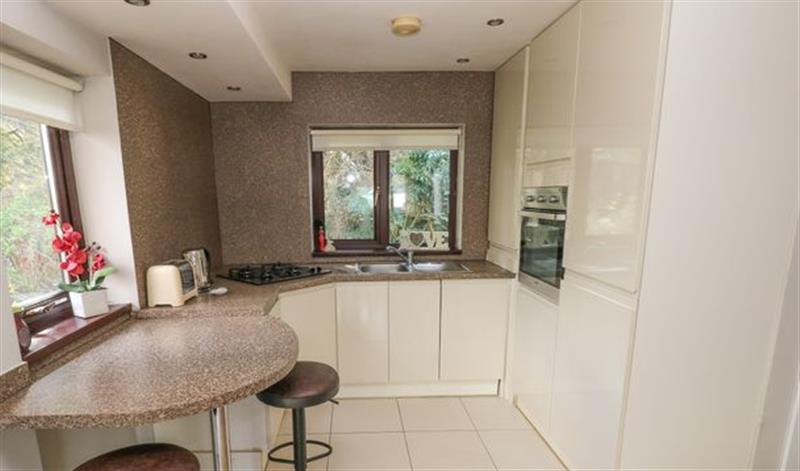Relax in the living area at The Garden Flat, South Wales & Pembrokeshire