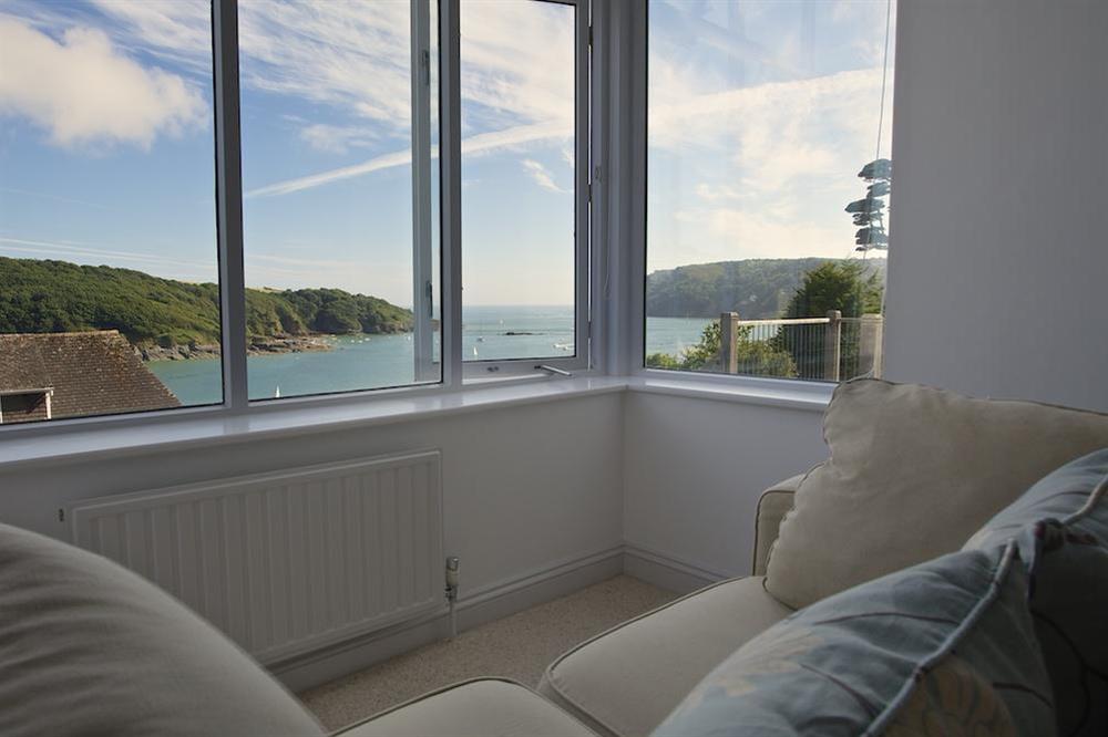 Enjoy views over the estuary from the sofa in the master bedroom at The Garden House (Woodside) in , Salcombe