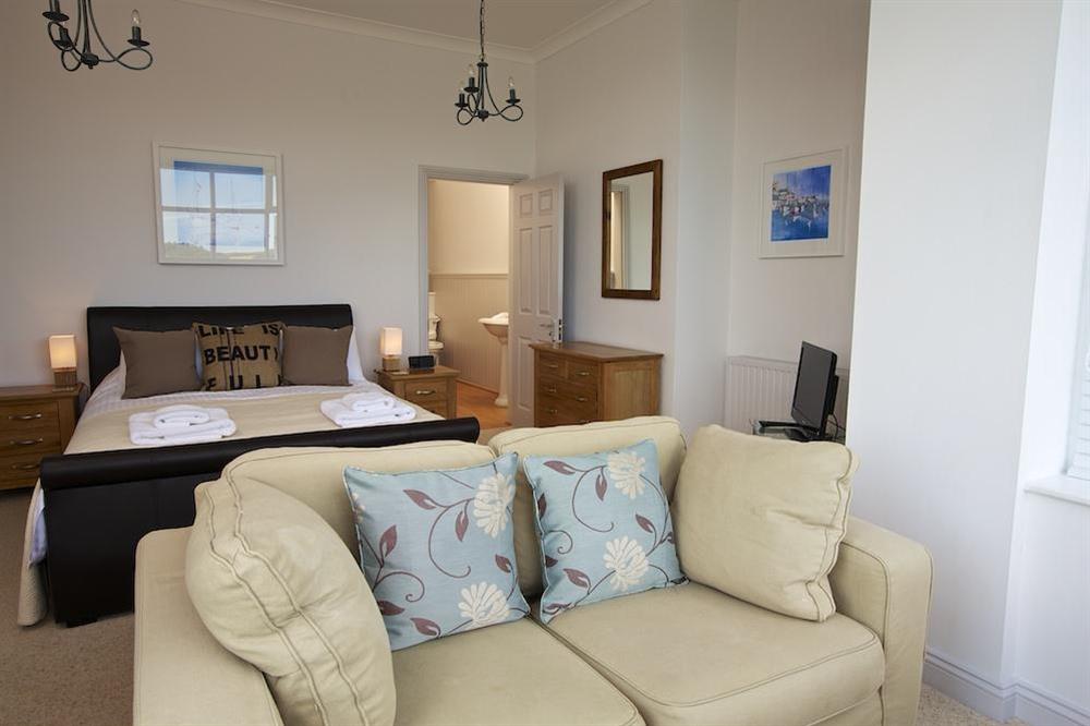 Master bedroom suite with sofa and stunning views (photo 3) at The Garden House (Woodside) in , Salcombe