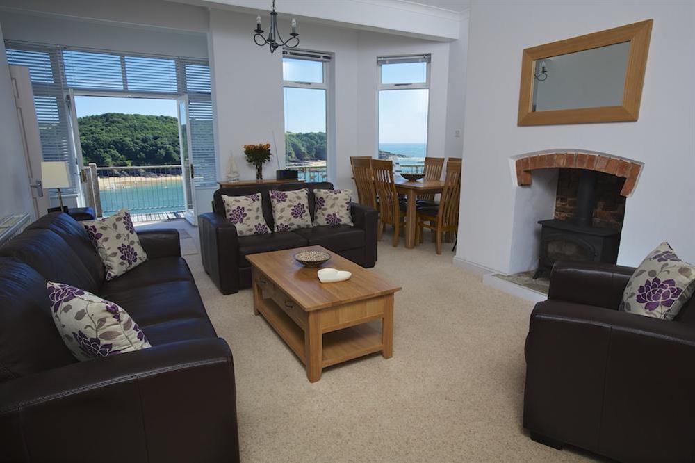 Open plan lounge/dining room with stunning views and doors out to terrace at The Garden House (Woodside) in , Salcombe