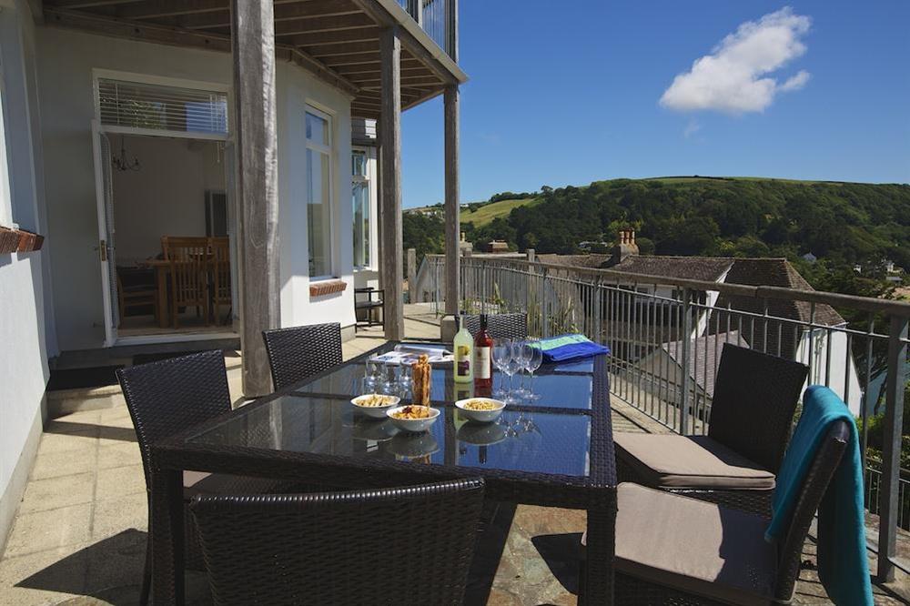 Spacious terrace with tables, chairs and lovely views at The Garden House (Woodside) in , Salcombe