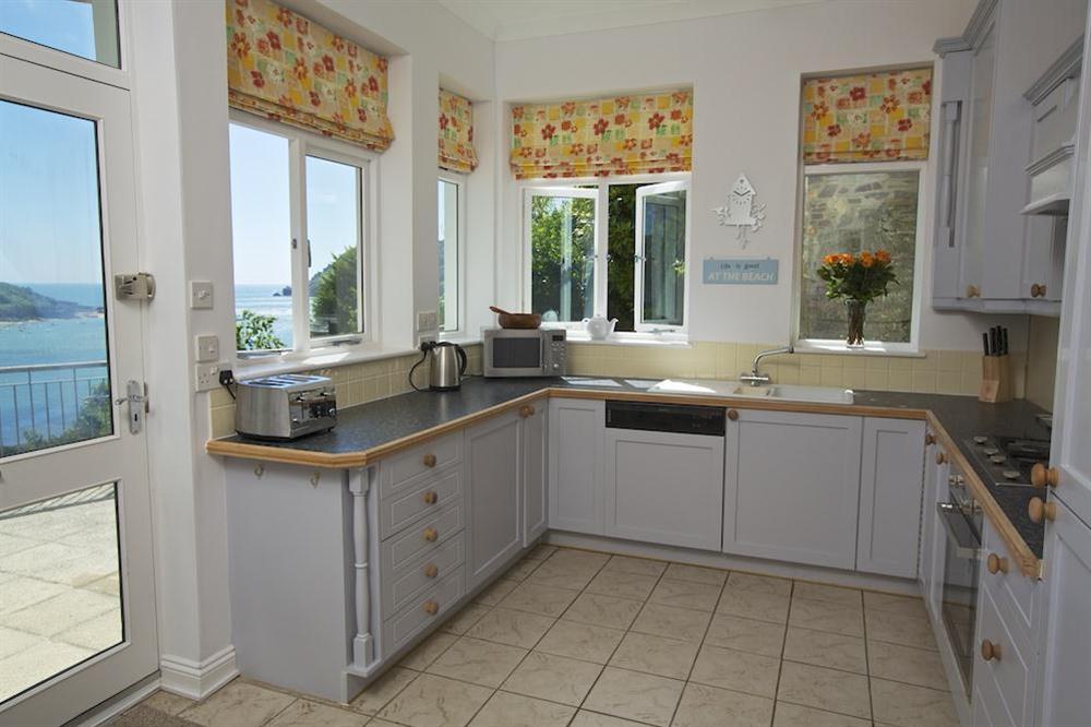 Well equipped kitchen with delightful estuary views at The Garden House (Woodside) in , Salcombe