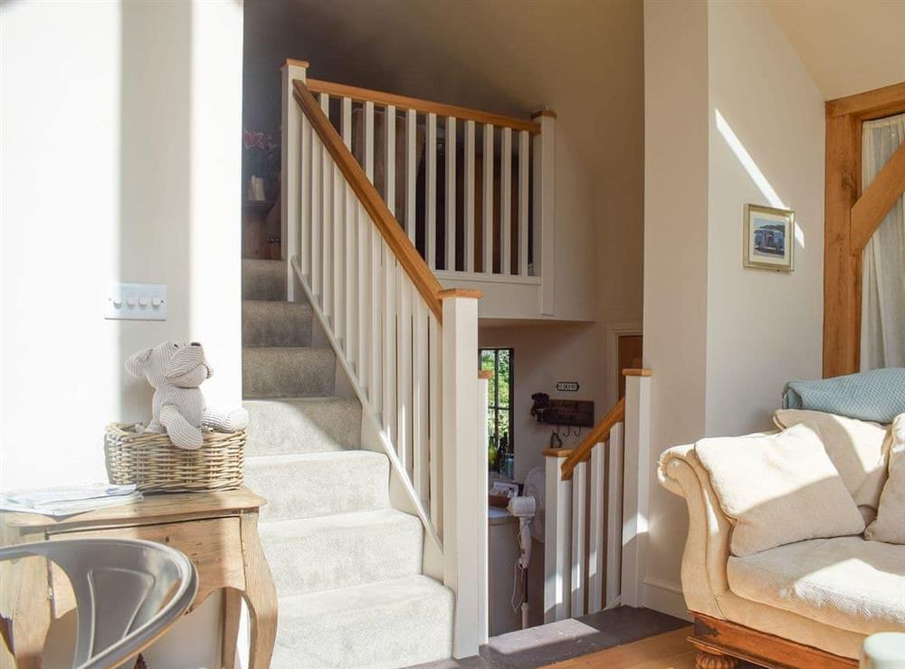Short staircase from the bedroom to the living areas at The Garden Retreat in Marbury, near Whitchurch, Hampshire