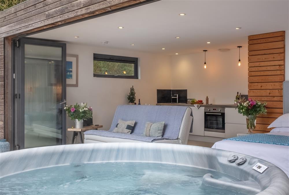 Relax in the hot tub  at The Garden Room, Westmeston
