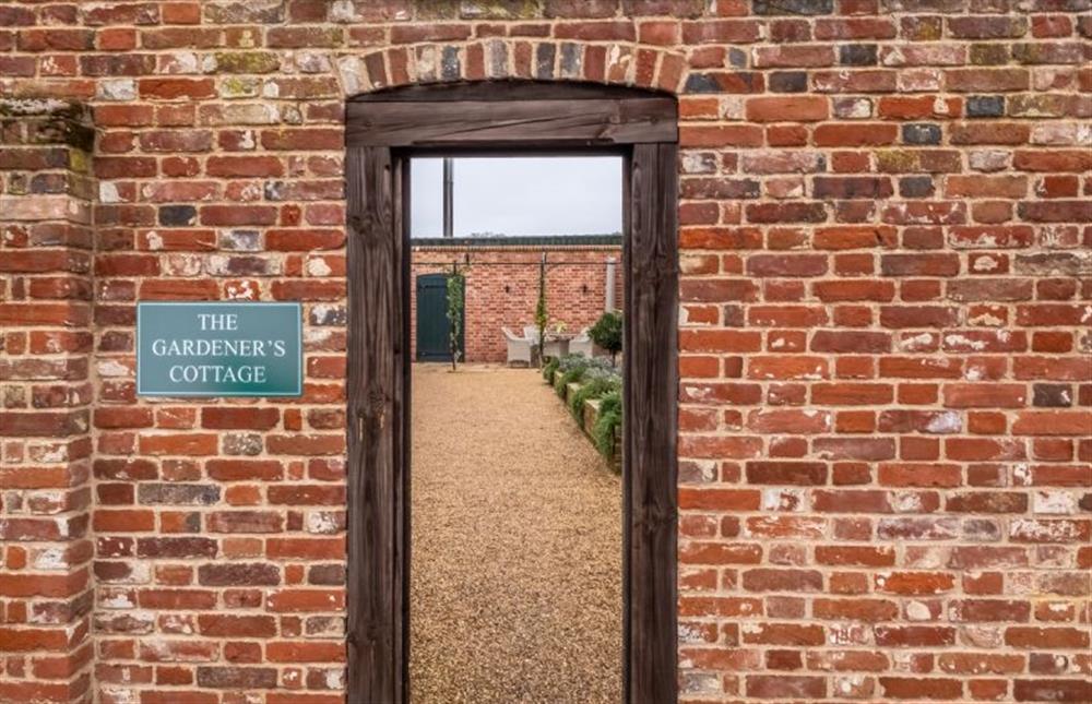 Parking is outside the entrance to the cottage and courtyard at The Gardeners Cottage, Earsham near Bungay